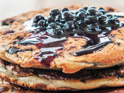 pancakes with blueberries and blueberry syrup