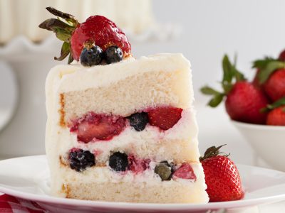 slice of Rouses bakery Gentilly cake topped with single strawberry