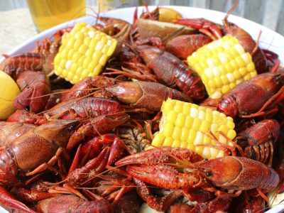 cooked crawfish and mini ears of corn