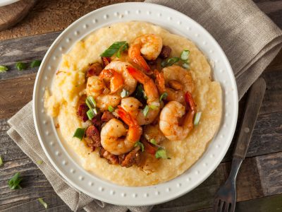 cooked yellow grits with Gulf shrimp and pork